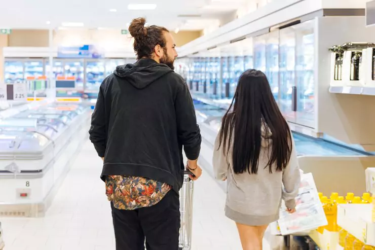 young couple shopping supermarket